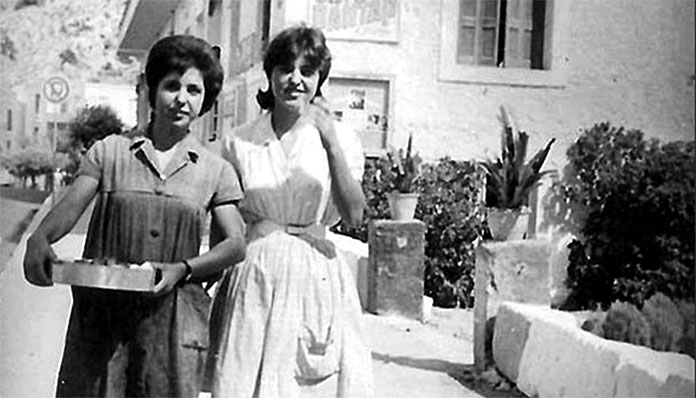 Women taking their yiouvetsi to their neighbourhood bakery